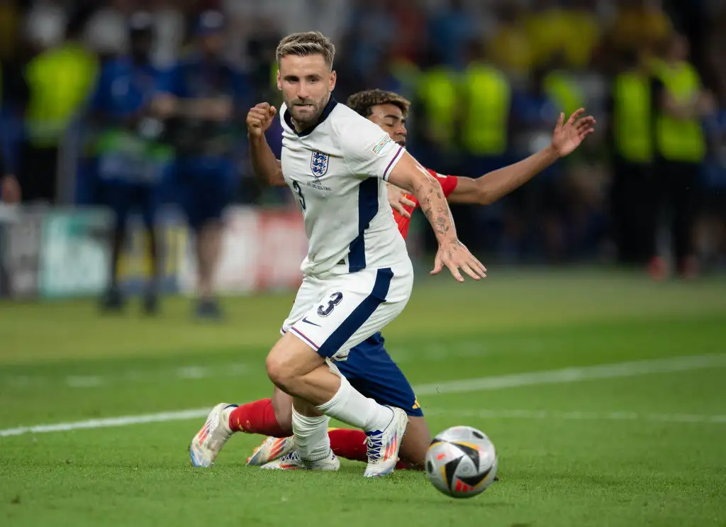 Luke Shaw of England and Lamine Yamal of Spain in action during the UEFA EURO 2024 final match between Spain and England at Olympiastadion on July 14, 2024 in Berlin, Germany