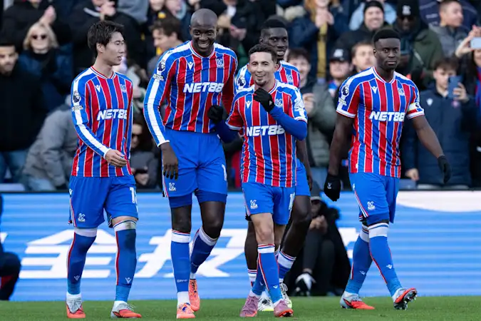 Jean-Philippe Mateta celebrates with Daichi Kamada, Yeremy Pino, Ismaila Sarr and Marc Guehi against Man Utd