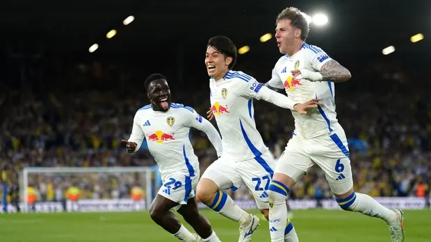 Ao Tanaka (centre) celebrates scoring Leeds’ first goal (Mike Egerton/PA)
