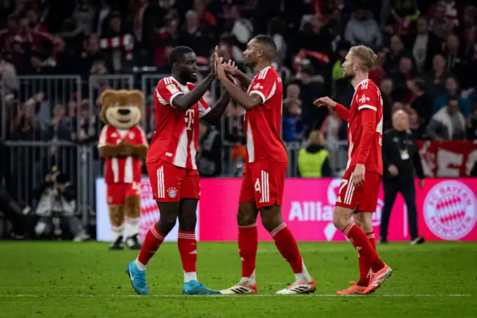 Dayot Upamecano, Jonathan Tah and Konrad Laimer celebrate during Bayern's 2-1 win over Dortmund