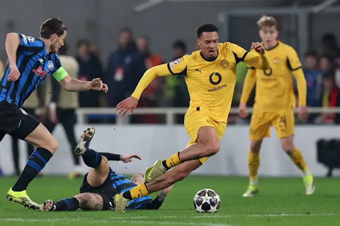Felix Nmecha of Borussia Dortmund avoids a tackle during the UEFA Champions League 2025/26 League Knockout Play-off Second Leg match between Atalanta BC and Borussia Dortmund