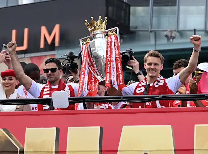 Mikel Arteta and Martin Odegaard celebrate at the Arsenal trophy parade