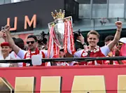 Mikel Arteta and Martin Odegaard celebrate at the Arsenal trophy parade