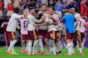 Spain's players celebrate their win over France in the 2026 World Cup semi finals.