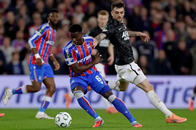 Crystal Palace defender Marc Guehi fends off AZ Alkmaar striker Troy Parrott
