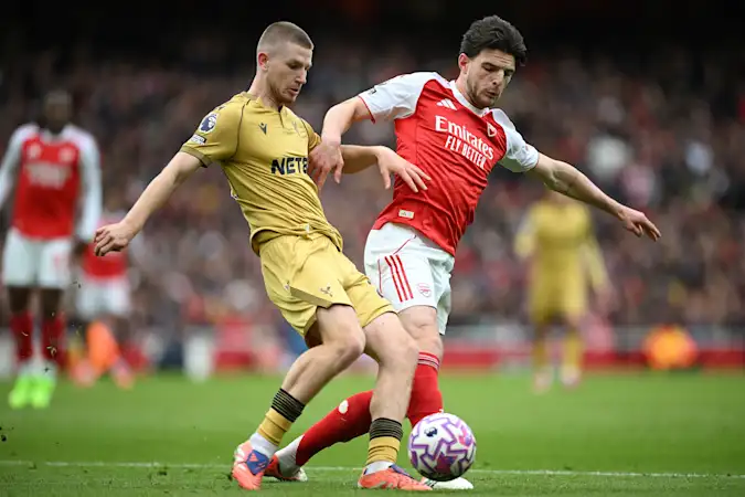 Crystal Palace midfielder Adam Wharton and Arsenal star Declan Rice in action