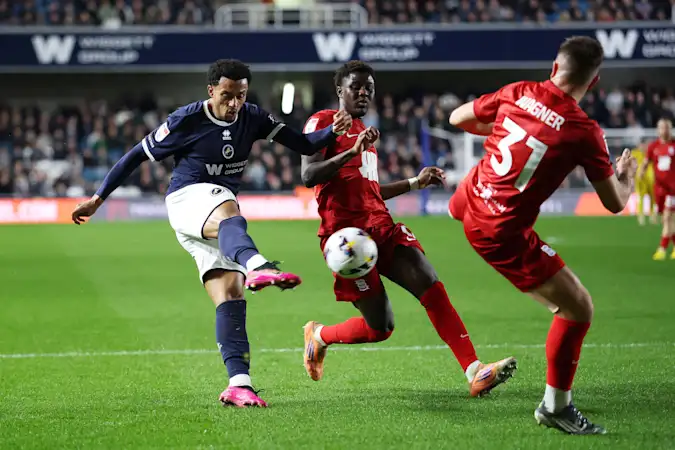 Femi Azeez of Millwall scores his team's first goal during the Sky Bet Championship match between Millwall and Birmingham City at The Den