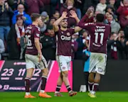 Claudio Braga (Centre) celebrates with Pierre Landry Kabore (R) after he scores the opening goal during the Premier League match between Heart of Midlothian and Aberdeen at Tynecastle Park