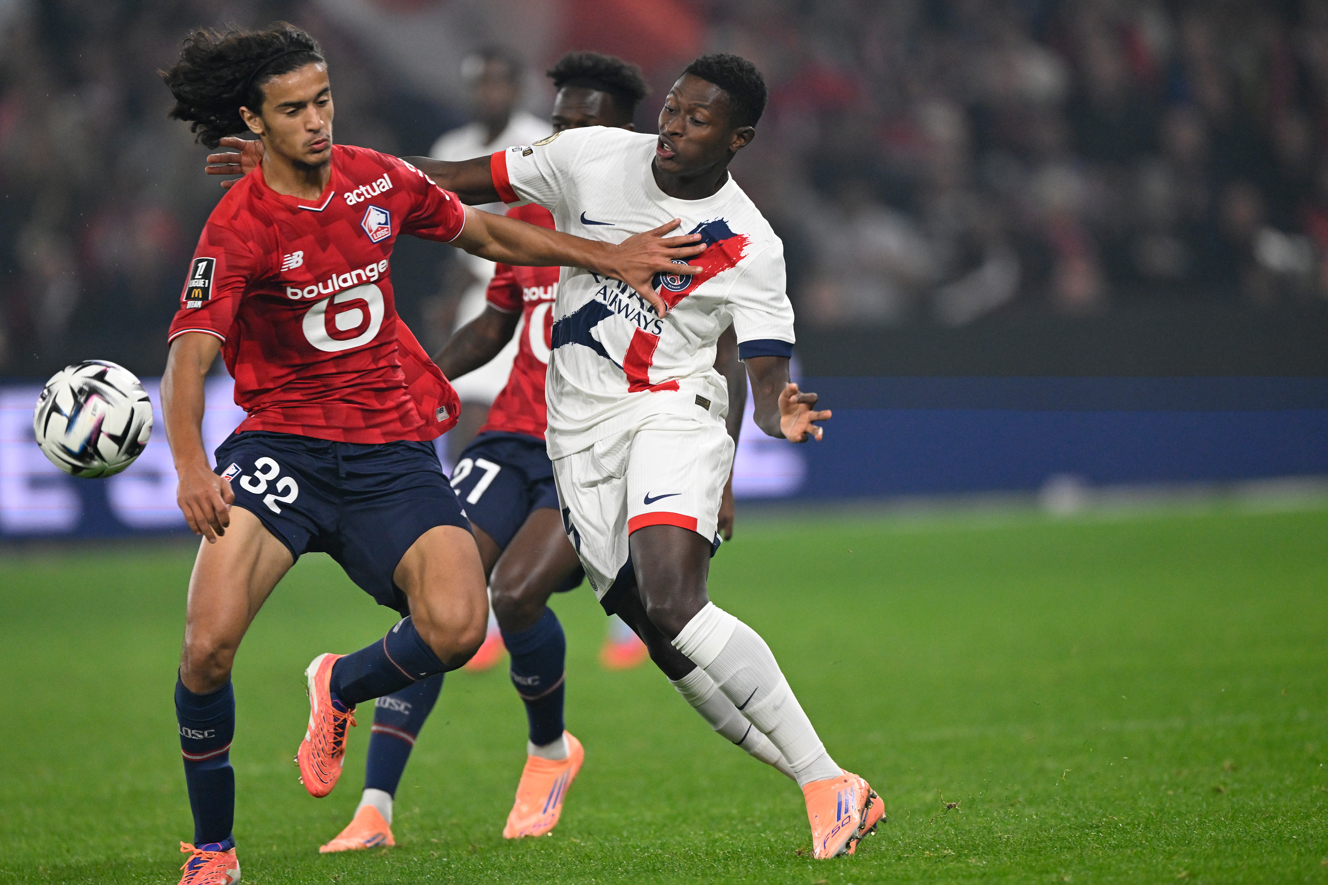 Ayyoub Bouaddi and Nuno Mendes battling for possession