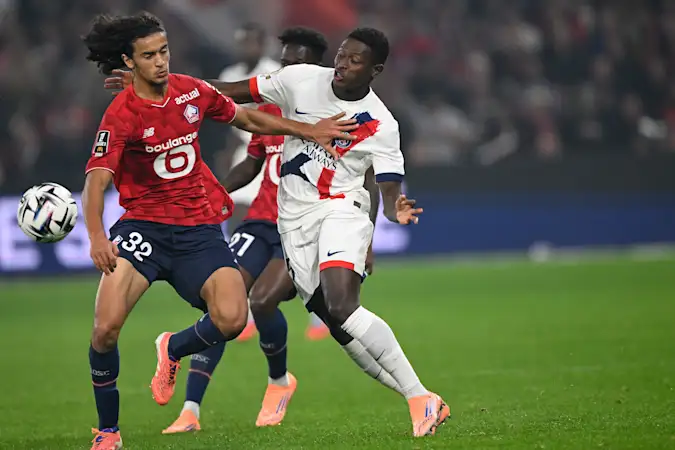 Ayyoub Bouaddi and Nuno Mendes battling for possession