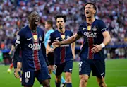 Ousmane Dembele celebrates scoring against Arsenal in the Champions League final