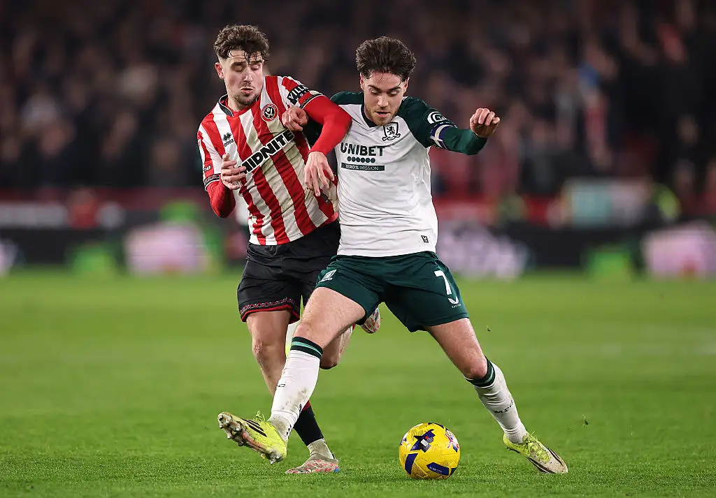 Hayden Hackney of Middlesbrough is challenged by Oliver Arblaster of Sheffield United during the Sky Bet Championship match between Sheffield United and Middlesbrough at Bramall Lane on February 09, 2026 in Sheffield, England