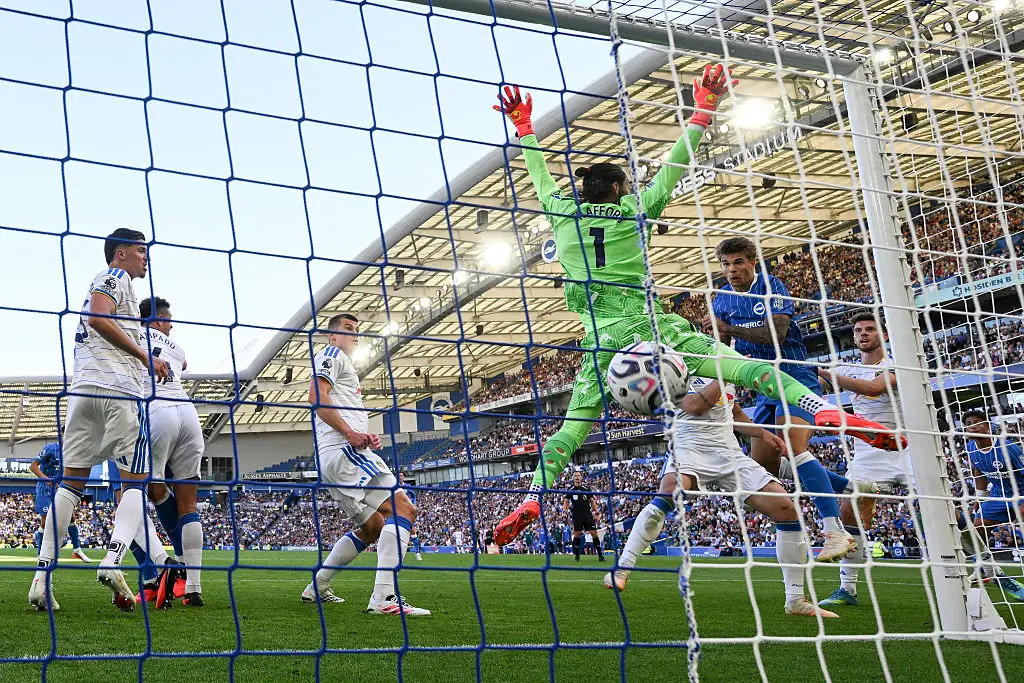 Luka Vuskovic of Brighton and Hove Albion scores despite the efforts of goalkeeper James Trafford of Leeds United during the Premier League 2026/27 match between Brighton & Hove Albion and Leeds United at American Express Stadium on September 05, 2026 in Brighton, England