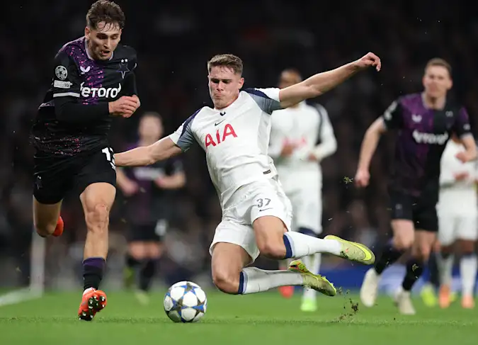 Micky van de Ven makes a tackle during Tottenham's Champions League win over Slavia Prague
