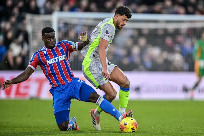 Marc Guehi tackling Matheus Nunes in Crystal Palace's 3-0 defeat to Man City