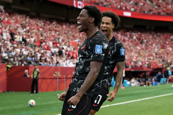 Jonathan David celebrates his first goal during Canada's eventual 6-0 Group B win over Qatar