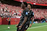 Jonathan David celebrates his first goal during Canada's eventual 6-0 Group B win over Qatar