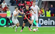 Maximilian Eggestein of Freiburg and Patrik Schick of Bayer Leverkusen