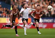 Bolton-s Josh Sheehan and Bradford City-s Antoni Sarcevic compete for the ball in the League One Play-Off Semi-Final first leg.