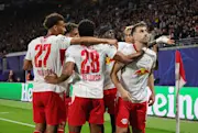 Brajan Gruda of RB Leipzig celebrates with teammates after scoring in the Champions League