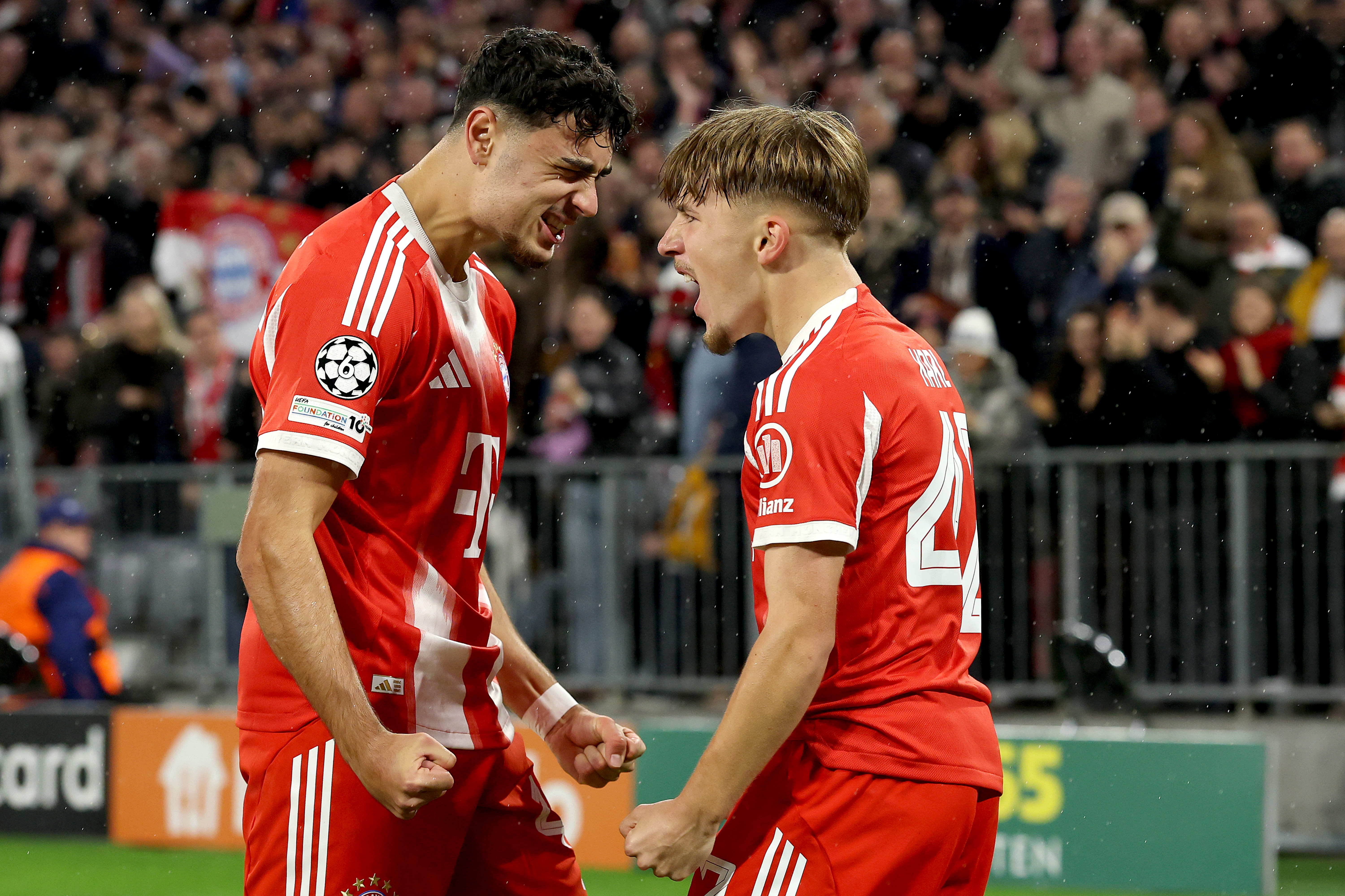 Aleksandar Pavlovic and Lennart Karl celebrate for Bayern against Club Brugge