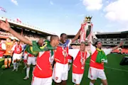 Gilberto, Patrick Vieira, Gael Clichy and Edu of Arsenal with the Premier League trophy after the match between Arsenal and Leicester City in the Premier League at Highbury on May 15, 2004 in London, England. (Photo by Stuart MacFarlane via Getty Images)