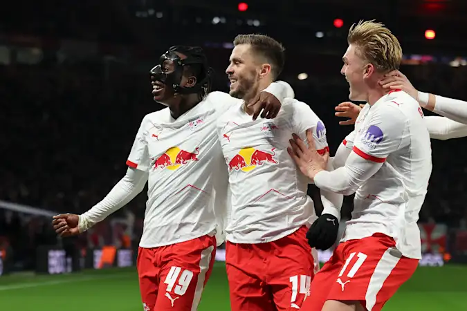 Yan Diomande, Christoph Baumgartner and Conrad Harder celebrate for RB Leipzig