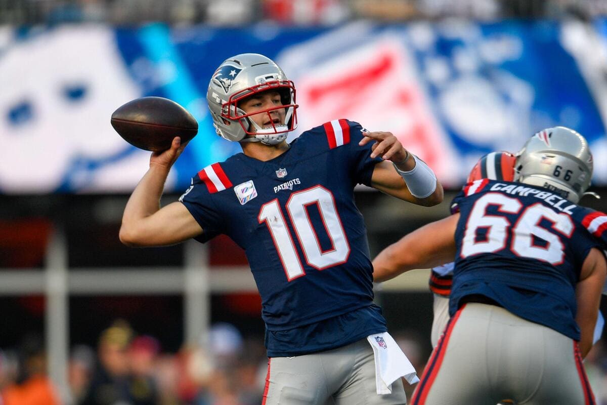 New England Patriots quarterback Drake Maye throwing a pass during a game.