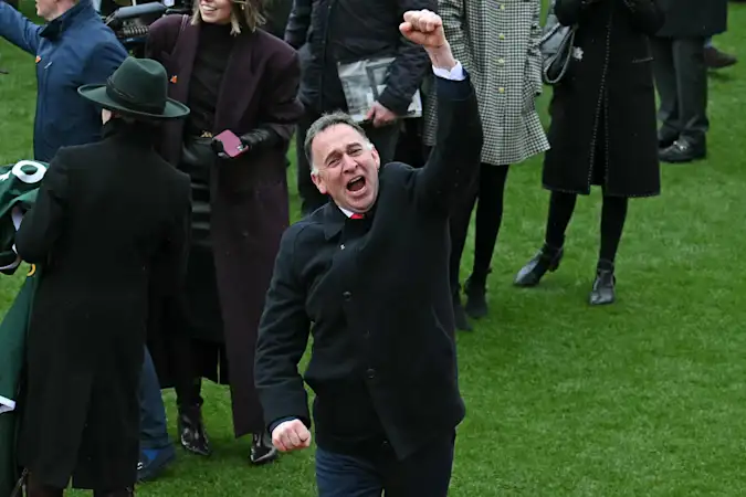 Winning trainer Henry De Bromhead celebrates in the winners enclosure.