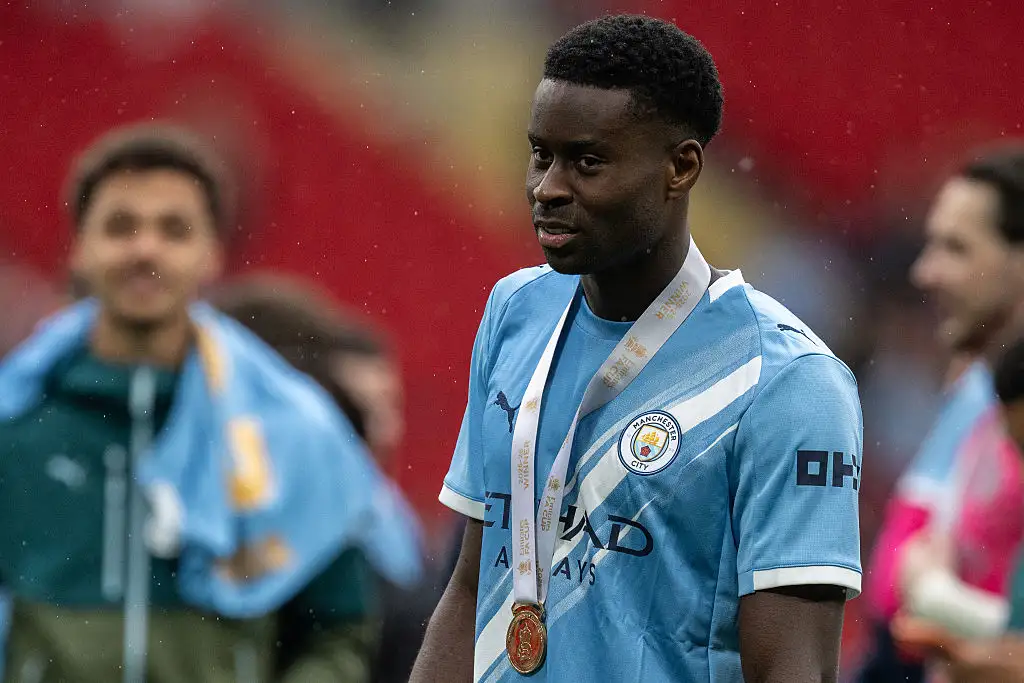 Marc Guehi of Manchester City with his winners medal after the Emirates FA Cup Final match between Chelsea and Manchester City on May 16, 2026 in London, England