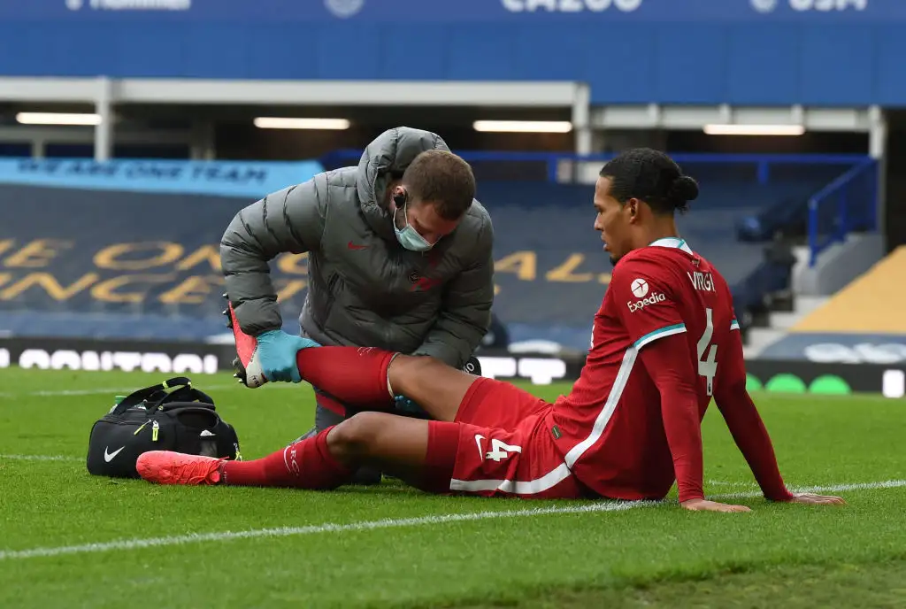 Virgil van Dijk of Liverpool collides with Everton's goalkeeper Jordan Pickford during the Premier League match between Everton and Liverpool at Goodison Park on October 17, 2020 in Liverpool, England