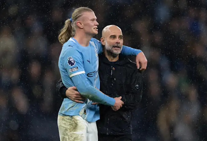Manchester City manager Pep Guardiola and Erling Haaland celebrate