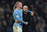 Manchester City manager Pep Guardiola and Erling Haaland celebrate