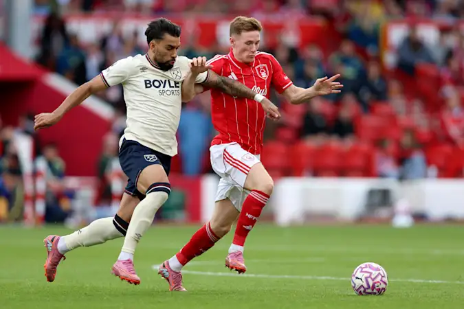 Lucas Paqueta and Elliot Anderson compete for possession