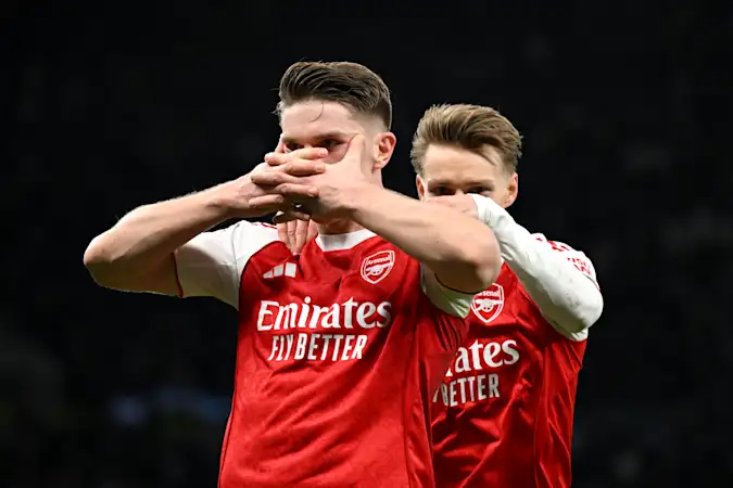 Viktor Gyoekeres of Arsenal celebrates with teammate Martin Odegaard after scoring his team's fourth goal during the Premier League match between Tottenham Hotspur and Arsenal at Tottenham Hotspur Stadium. (Photo by Mike Hewitt/Getty Images)