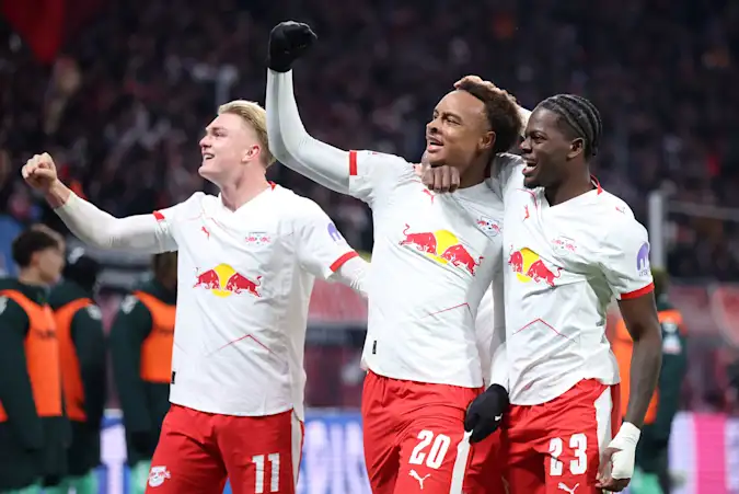 Conrad Harder, Assan Ouedraogo and Castello Lukeba celebrate for RB Leipzig against Werder Bremen