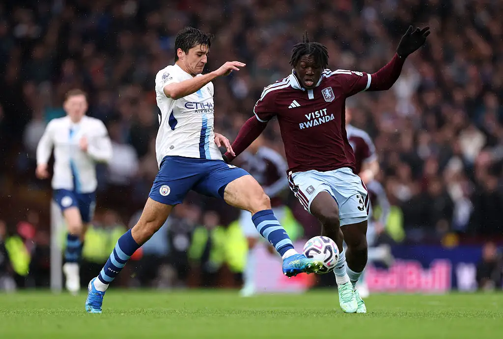 Brian Madjo of Aston Villa is challenged by Abdukodir Khusanov of Manchester City during the Premier League 2026/27 match between Aston Villa FC and Manchester City at Villa Park on October 24, 2026 in Birmingham, England.
