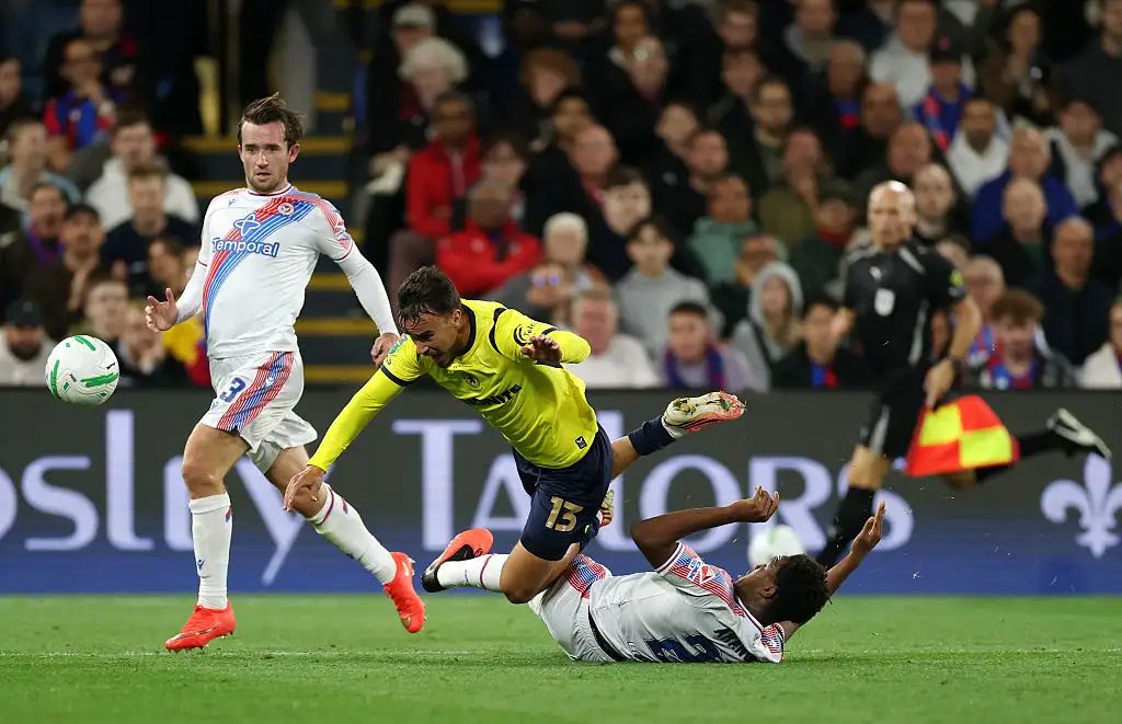 David Strelec of Middlesbrough is tackled by Honest Ahanor of Crystal Palace as Ben Chilwell of Crystal Palace looks on during the Carabao Cup Third Round match between Crystal Palace and Middlesbrough at Selhurst Park on September 08, 2026 in London, England