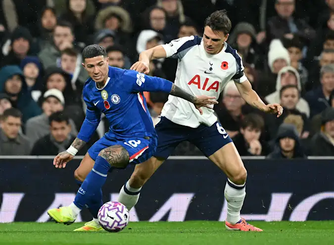 Chelsea midfielder Enzo Fernandez battles Tottenham's Joao Palhinha for possession