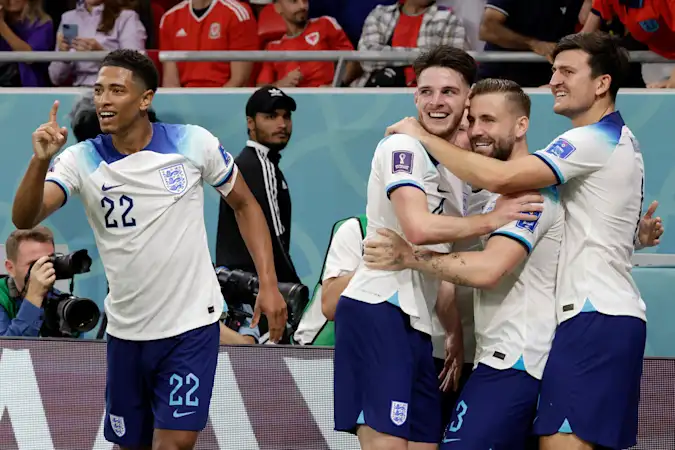 Jude Bellingham, Declan Rice, Luke Shaw and Harry Maguire of England celebrating during the FIFA World Cup Qatar 2022 Group B match between Wales and England