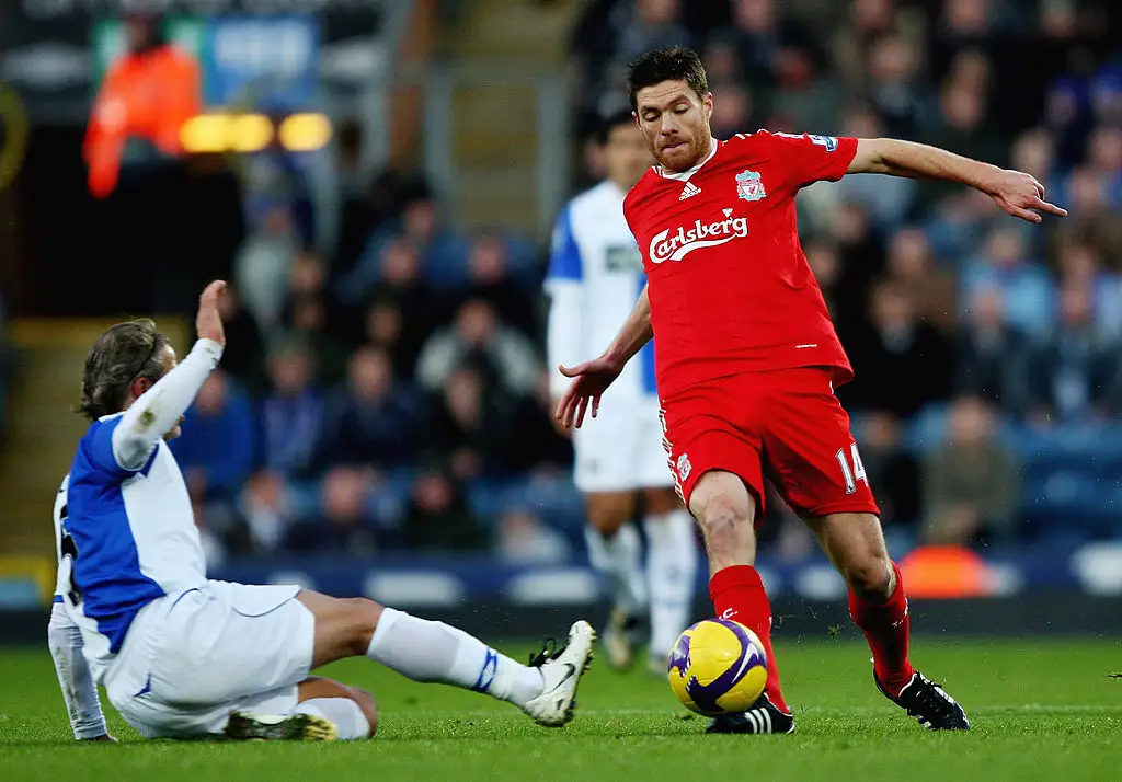 Xabi Alonso of Liverpool in action with Tugay of Blackburn Rovers during the Barclays Premier League match between Blackburn Rovers and Liverpool at Ewood Park on December 6, 2008 in Blackburn, England