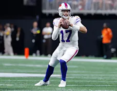 Buffalo Bills quarterback Josh Allen preparing to throw a football during a game.