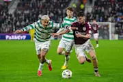 Claudio Braga of Hearts holds off Julian Ajauro of Celtic during a Premiership match.