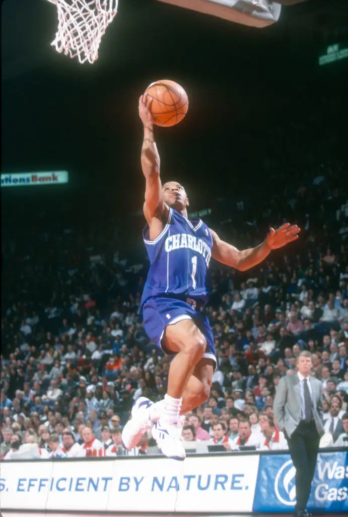 Muggsy Bogues #1 of the Charlotte Hornets shoots against the Washington Bullets during an NBA basketball game circa 1995 at the US Airways Arena in Landover, Maryland. Bogues played for the Hornets from 1988-97.