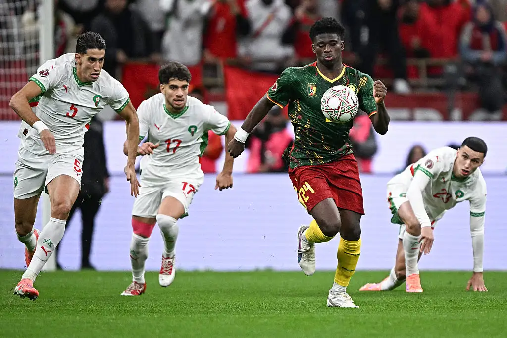 Cameroon's midfielder #24 Carlos Baleba (2nd R) fights for the ball with Morocco's defender #05 Nayef Aguerd (L), Morocco's midfielder #17 Abde Ezzalzouli (2nd L) and Morocco's midfielder #23 Bilal El Khannouss (R) during the Africa Cup of Nations (CAN) quarter-final football match between Cameroon and Morocco at the Prince Moulay Abdallah stadium in Rabat on January 9, 2026