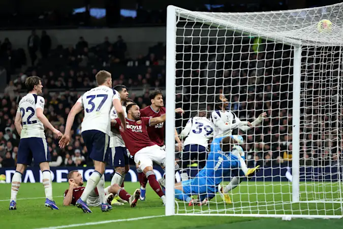 Callum Wilson of West Ham United scores his team's second goal past Guglielmo Vicario of Tottenham Hotspur