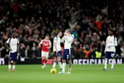 Xavi Simons of Tottenham Hotspur looks dejected after Eberechi Eze of Arsenal (not pictured) scores his team's third goal during the Premier League match between Tottenham Hotspur and Arsenal at Tottenham Hotspur Stadium