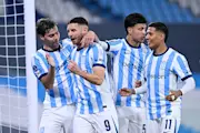 Racing Club's players celebrate a goal against Caracas in the Copa Sudamericana.